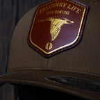 AO duck hunting cap with leather patch and gold-foil detail