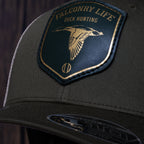 AO duck hunting cap with leather patch and gold-foil detail