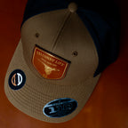 AO duck hunting cap with leather patch and gold-foil detail