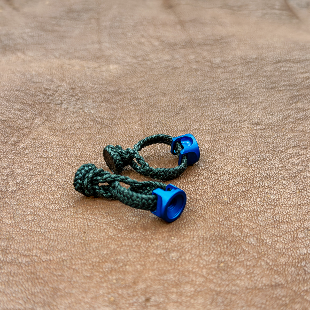 Two black braided Kevlar transmitter straps with blue Marshall EZ-Twist fittings